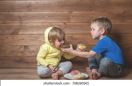 Child sharing their snacks with each other